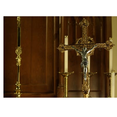 The ornate crucifix and candlesticks on the high altar
